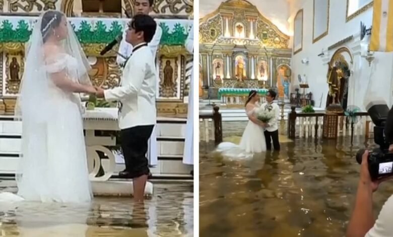 La pareja se casó el día de la iglesia de la inundación después de un golpe de tifón La pareja se casó el día de la iglesia de la inundación después de un golpe de tifón