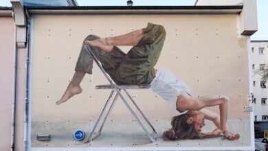 El acróbata en los enormes murales de Artez se presenta a la activación de edificios urbanos, enormes