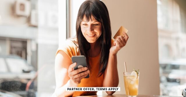 SOCIAL-IMAGE_PARTNER-OFFER-TERMS-APPLY_woman-with-credit-card-using-smart-phone-in-cafe_Westend61_30.jpeg